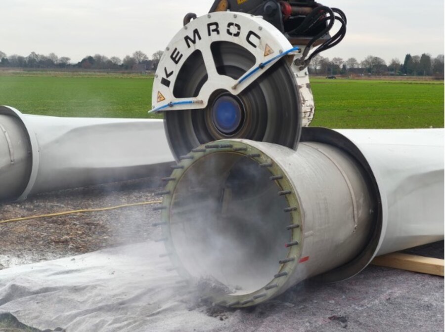 Wind turbine blade being cut into segments on site